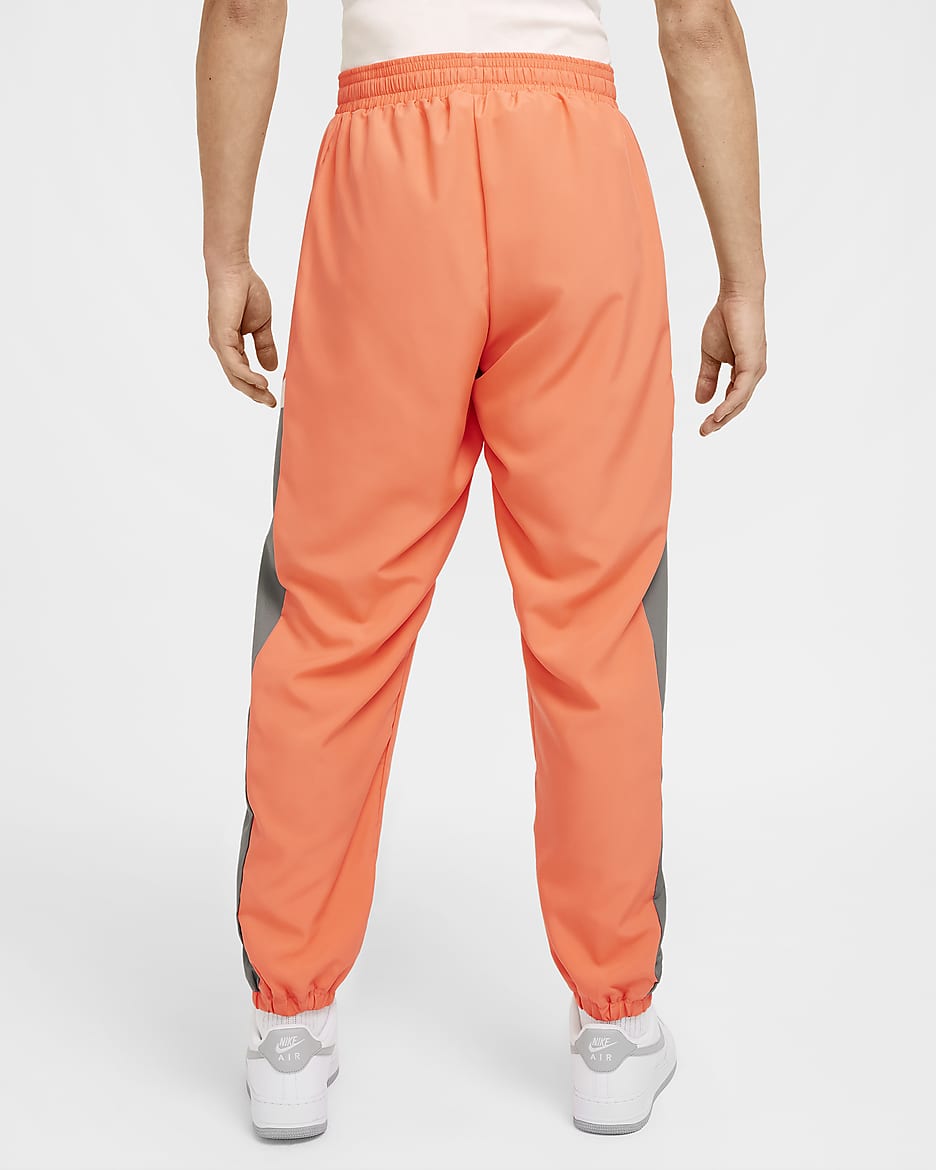 Pantaloni nike uomo arancione on sale